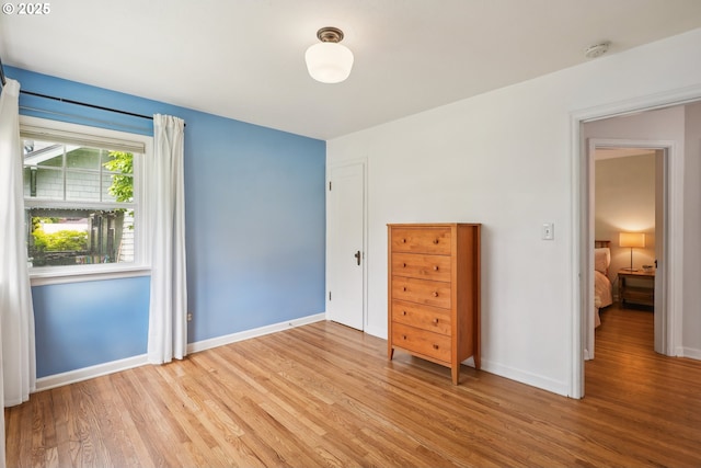 6134 NE 25th Ave, Portland, OR 97211 - bedroom featuring light wood-style flooring and baseboards