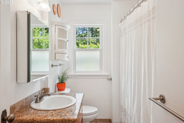 6134 NE 25th Ave, Portland, OR 97211 - bathroom featuring vanity, toilet, and a shower with curtain