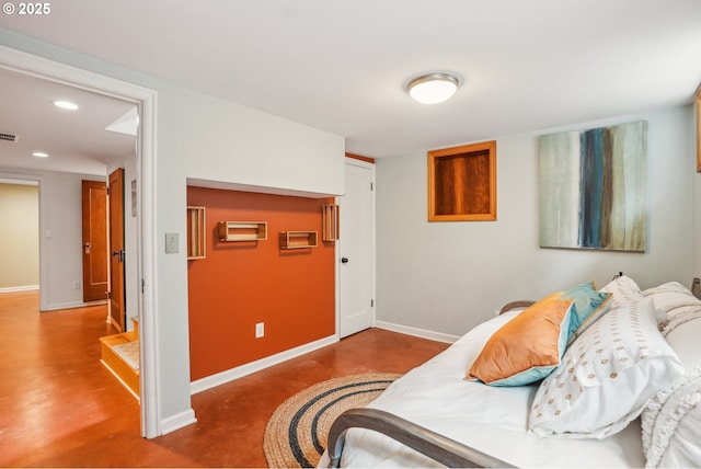 6134 NE 25th Ave, Portland, OR 97211 - bedroom featuring finished concrete floors, baseboards, recessed lighting, and a closet