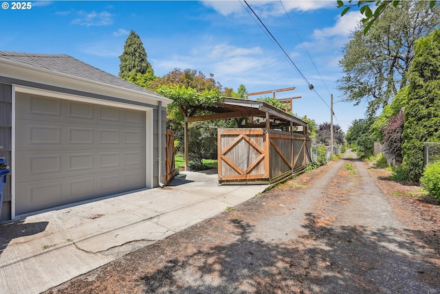6134 NE 25th Ave, Portland, OR 97211 - garage featuring concrete driveway