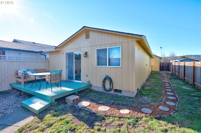 rear view of house with a deck