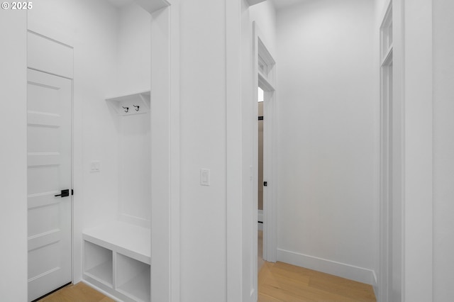 mudroom with light hardwood / wood-style flooring