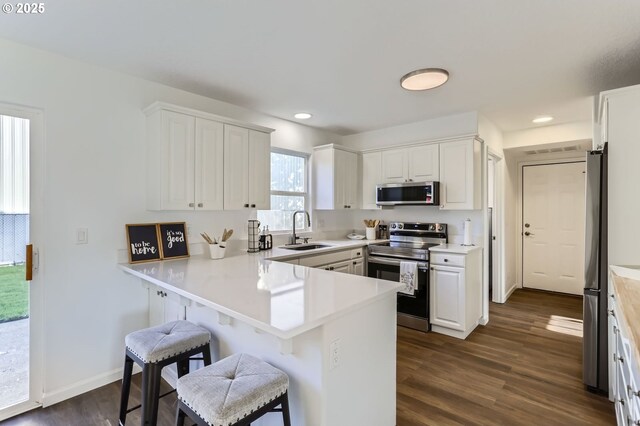 1189 S Aspen Way, Canby, OR 97013 - dining room featuring dark wood-style flooring and baseboards