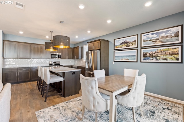 1939 Branch Creek Dr, Longview, WA 98632 - dining area with wood finished floors and recessed lighting