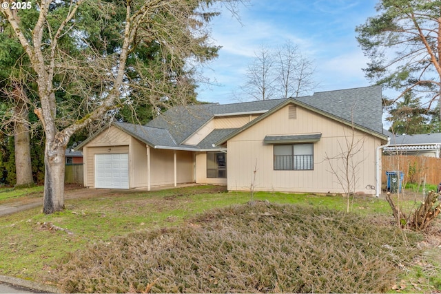 view of front of home featuring a garage and a front lawn