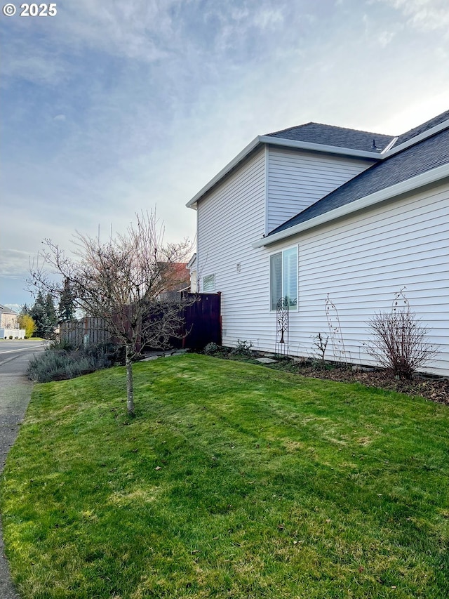 view of home's exterior with a lawn