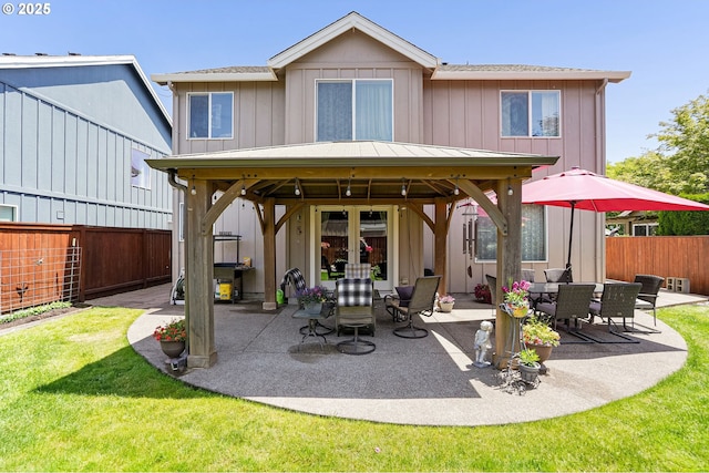 216 Churchill Downs St, Albany, OR 97322 - rear view of property with a gazebo, a patio area, a fenced backyard, and board and batten siding