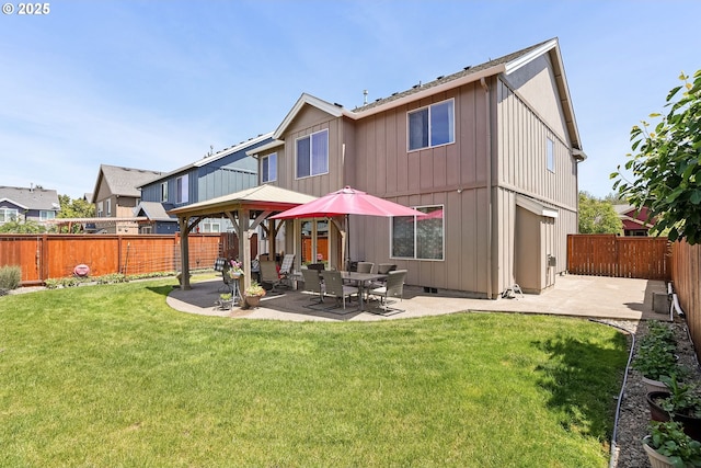 216 Churchill Downs St, Albany, OR 97322 - back of property featuring a patio and a fenced backyard