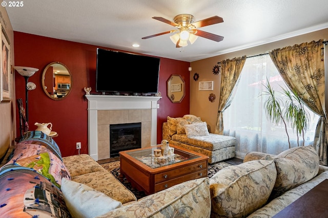 216 Churchill Downs St, Albany, OR 97322 - living room with ceiling fan, a tiled fireplace, and recessed lighting