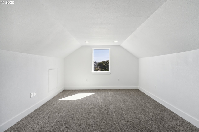 bonus room featuring carpet floors, lofted ceiling, and baseboards