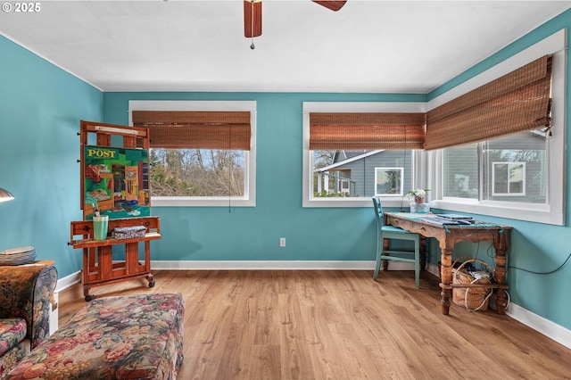 sitting room featuring light wood-style floors, ceiling fan, and baseboards