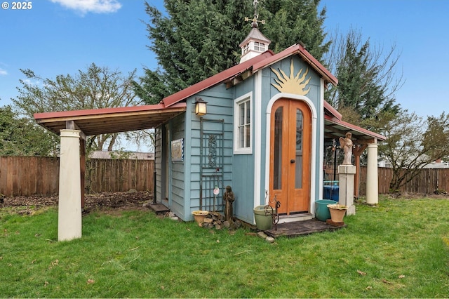 view of shed with a fenced backyard