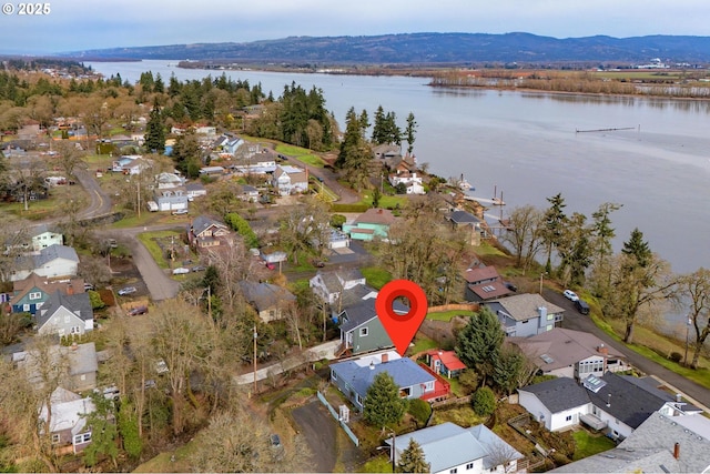 aerial view featuring a residential view and a water and mountain view