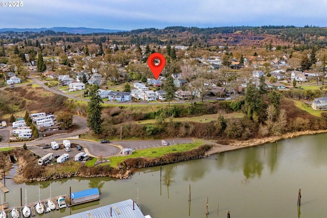 drone / aerial view with a residential view and a water view