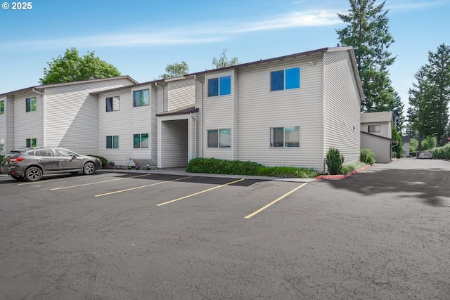 12510 SE Stark St Unit H, Portland, OR 97233 - view of property featuring uncovered parking