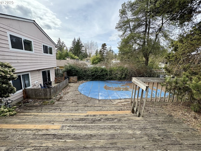 view of swimming pool featuring a deck