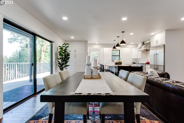 dining room with recessed lighting and wood finished floors