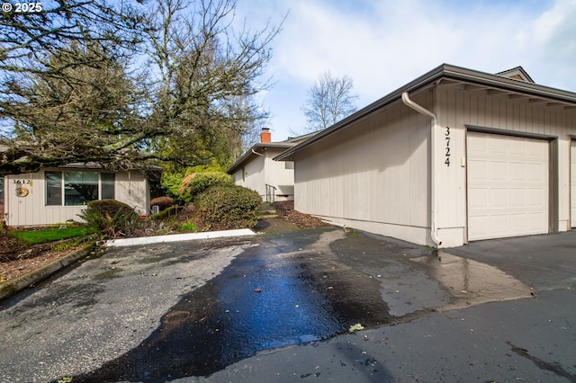 view of home's exterior featuring an attached garage