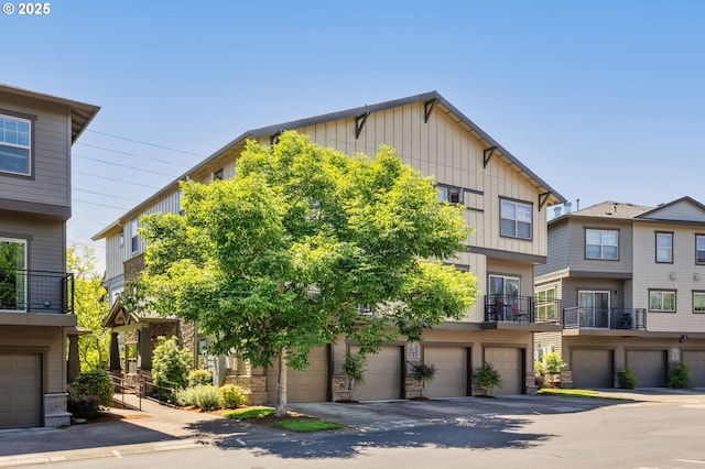 8844 NE Brentford Way, Hillsboro, OR 97006 - view of property featuring board and batten siding and a garage