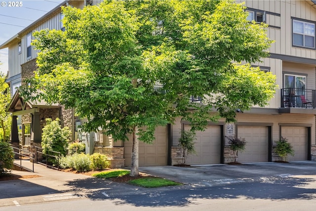 8844 NE Brentford Way, Hillsboro, OR 97006 - townhome / multi-family property with stone siding and board and batten siding