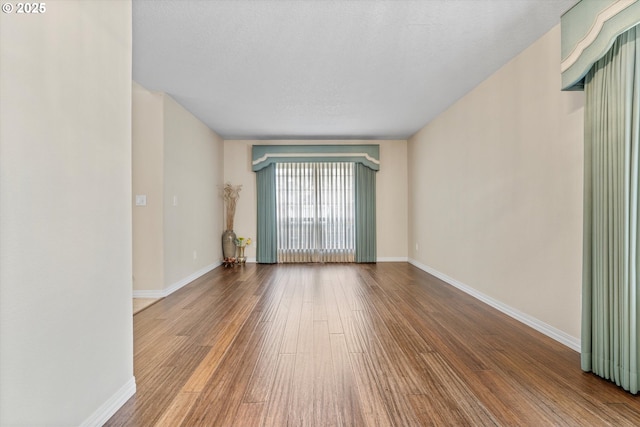 2462 NE 11th Ave, Hillsboro, OR 97124 - spare room with wood finished floors and baseboards