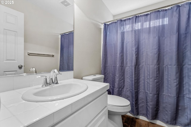 2462 NE 11th Ave, Hillsboro, OR 97124 - full bathroom featuring wood finished floors, toilet, vanity, and a shower with shower curtain