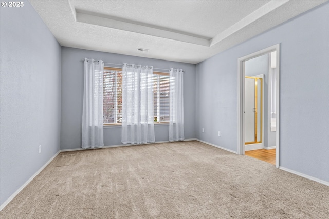2462 NE 11th Ave, Hillsboro, OR 97124 - empty room featuring carpet, baseboards, and a textured ceiling