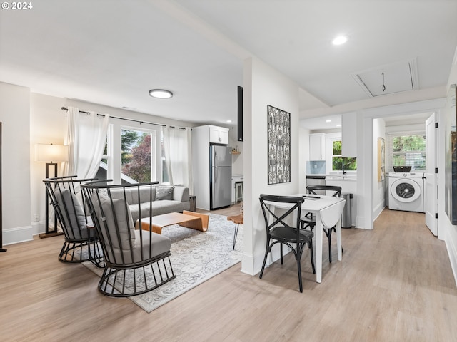 living room with plenty of natural light and light wood-type flooring