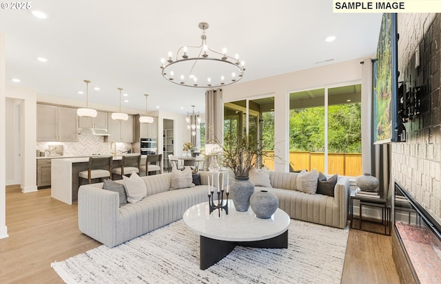 8705 S 4th Way, Ridgefield, WA 98642 - living room with a chandelier, light wood-style flooring, and recessed lighting