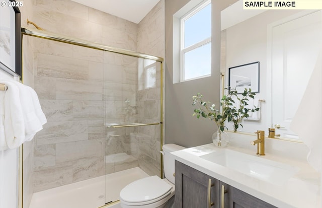 8705 S 4th Way, Ridgefield, WA 98642 - bathroom featuring vanity, toilet, and a stall shower