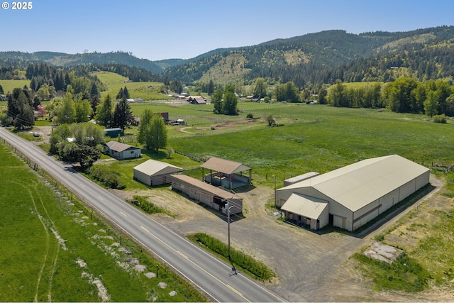 aerial view featuring a mountain view and a rural view