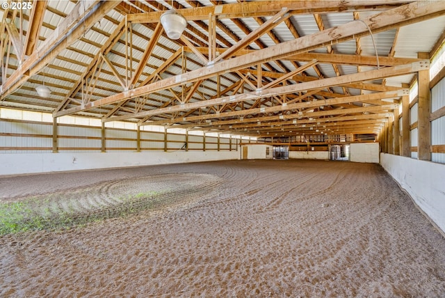 interior space featuring carpet floors and high vaulted ceiling