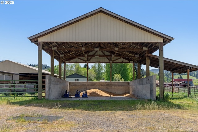 view of property's community featuring an exterior structure and a detached carport