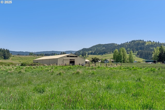 mountain view featuring a rural view
