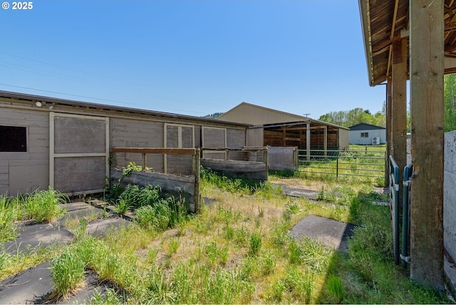 view of yard with an outbuilding and an exterior structure
