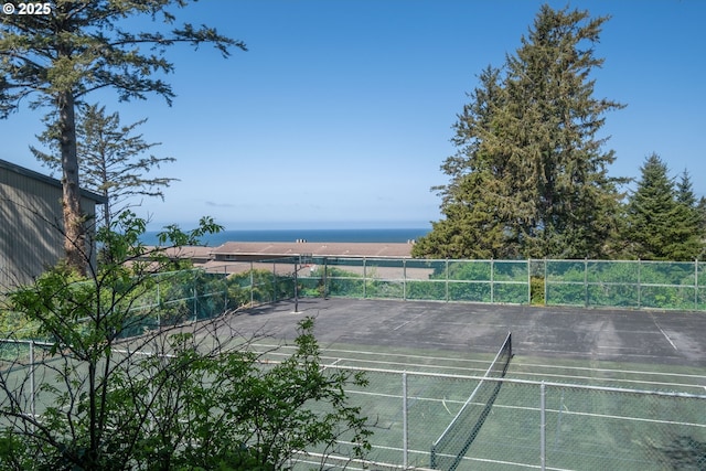 view of tennis court featuring fence
