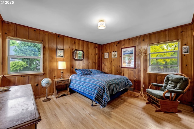 1815 SE 97th Ave, Vancouver, WA 98664 - bedroom featuring multiple windows, light wood-style flooring, wooden walls, and baseboards