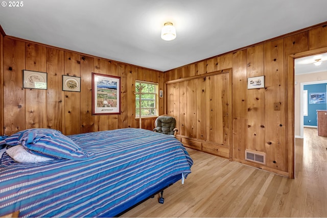1815 SE 97th Ave, Vancouver, WA 98664 - bedroom featuring wood walls, ornamental molding, wood finished floors, and a closet