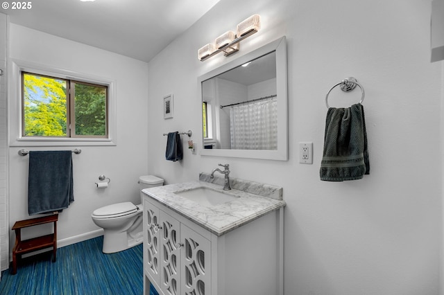 1815 SE 97th Ave, Vancouver, WA 98664 - full bathroom with toilet, vanity, baseboards, wood finished floors, and a shower with shower curtain