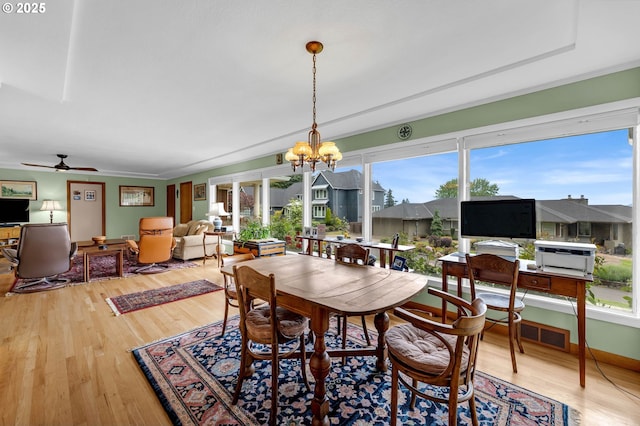 1815 SE 97th Ave, Vancouver, WA 98664 - dining room featuring wood finished floors, a chandelier, and a ceiling fan