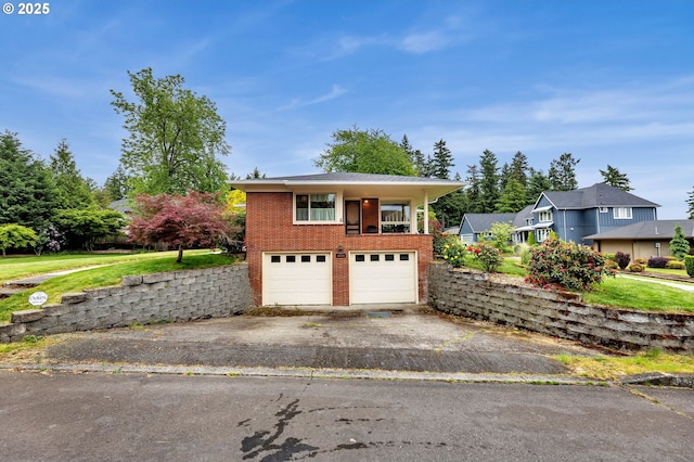 1815 SE 97th Ave, Vancouver, WA 98664 - view of front of property featuring asphalt driveway, brick siding, and a garage