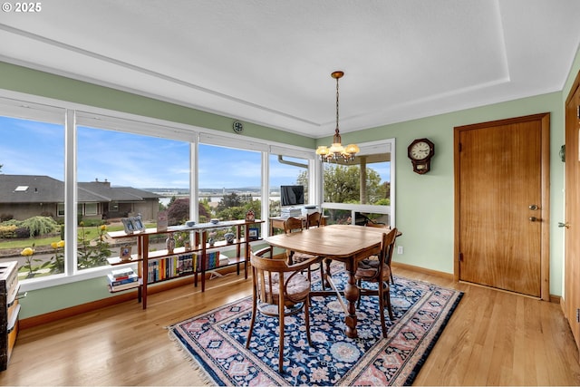1815 SE 97th Ave, Vancouver, WA 98664 - dining space featuring a chandelier, light wood-style floors, and baseboards