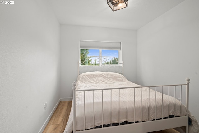 1013 Peach Rd, Winlock, WA 98596 - bedroom with baseboards and wood finished floors