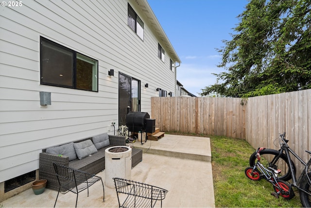 1013 Peach Rd, Winlock, WA 98596 - fenced backyard with a patio, area for grilling, and an outdoor living space with a fire pit