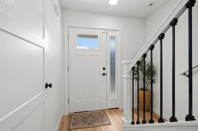 1013 Peach Rd, Winlock, WA 98596 - entryway featuring wood finished floors, stairway, and baseboards