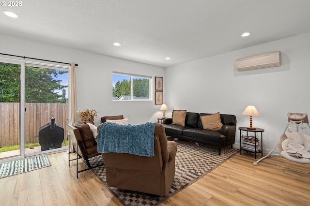 1013 Peach Rd, Winlock, WA 98596 - living room with a wall mounted air conditioner, light wood-style floors, and recessed lighting