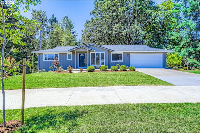 7471 SW Woodbury Loop, Wilsonville, OR 97070 - ranch-style home with driveway, a garage, and a front yard