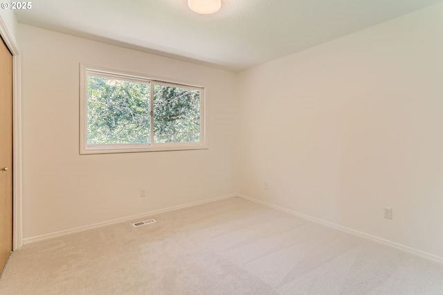 7471 SW Woodbury Loop, Wilsonville, OR 97070 - spare room featuring light colored carpet