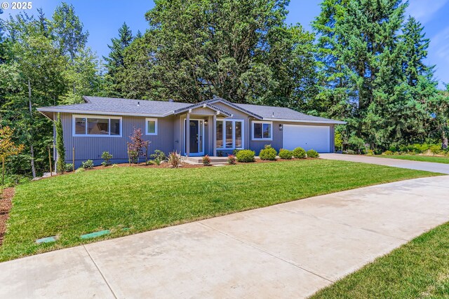 7471 SW Woodbury Loop, Wilsonville, OR 97070 - single story home featuring concrete driveway, a front lawn, and an attached garage