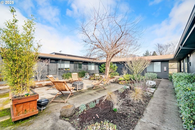 view of patio / terrace with a fire pit